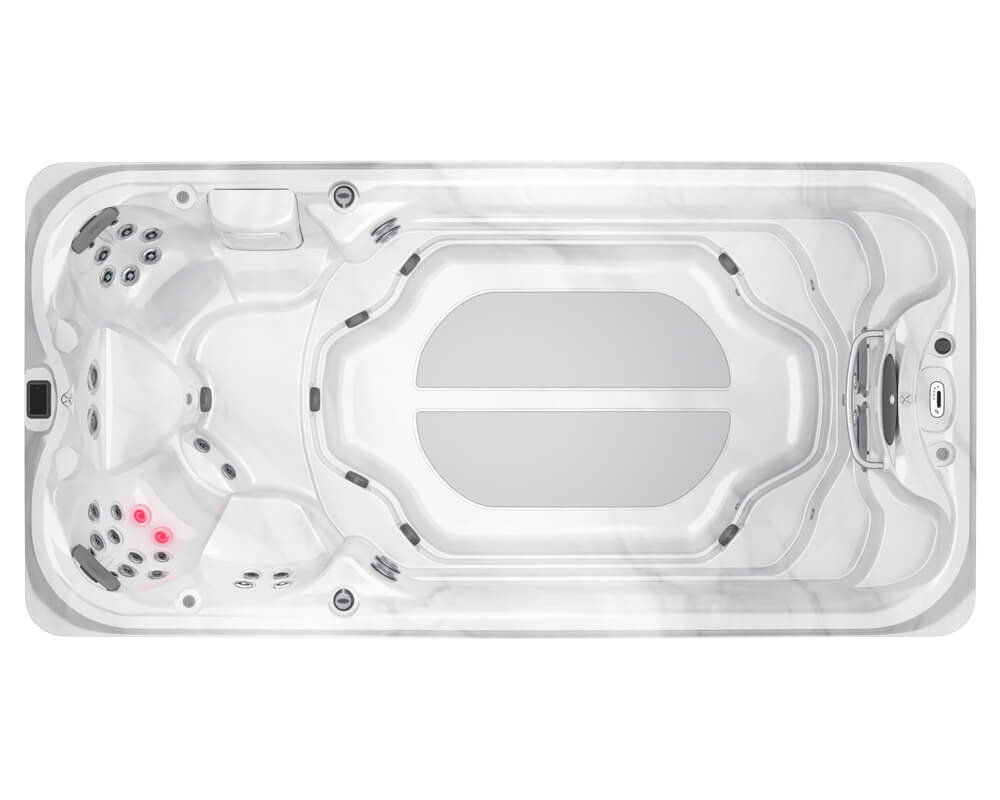 White rectangular outdoor hot tub viewed from above, showing multiple jet seats and a central seating area with a pale gray interior.