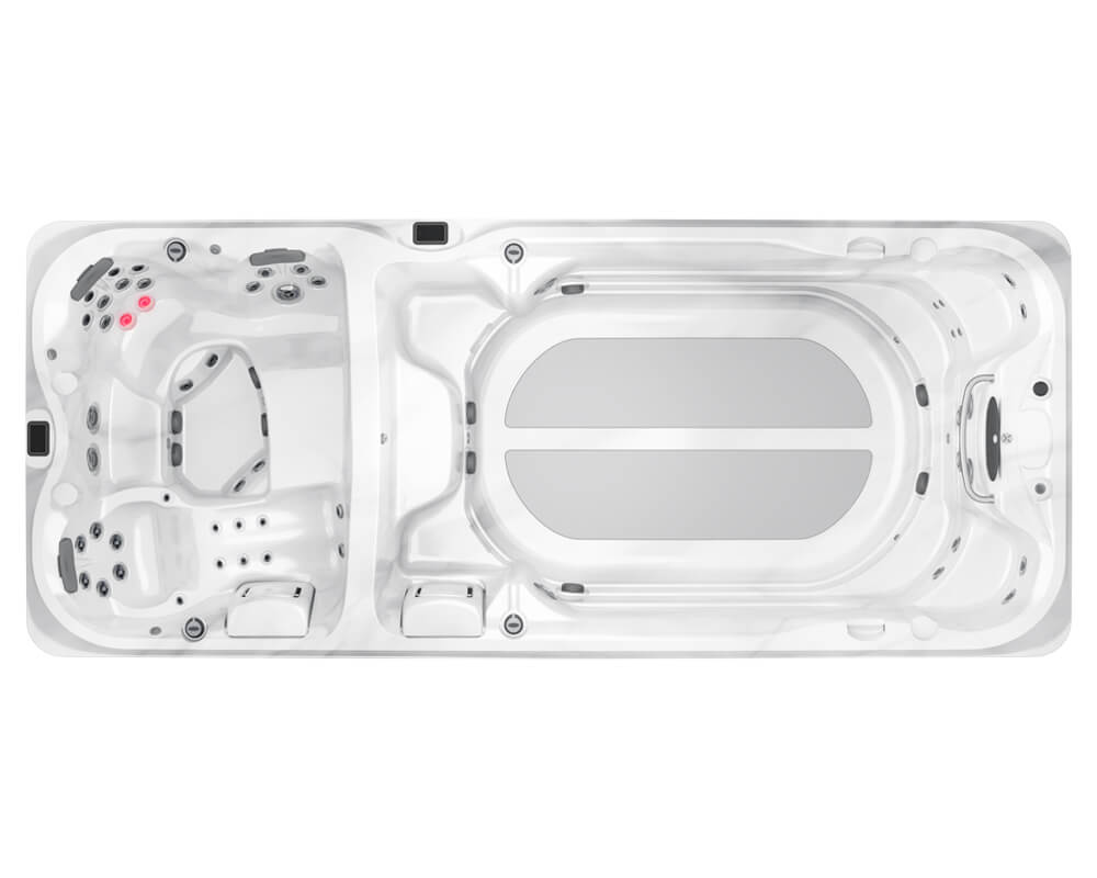 Top-down view of a white hot tub with multiple jet seats and a built-in lounge area, seen from above.